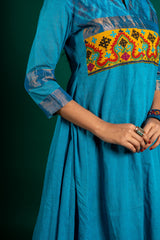 Blue handloom Kali top paired with ikat and Kutch work on yoke with mustard dupatta with work and pant