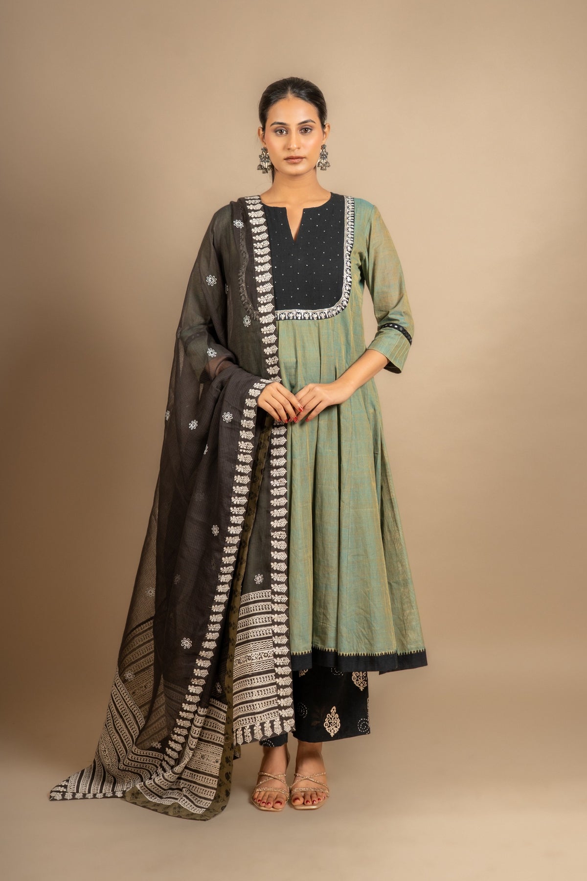 Green with black handloom Kali top mirror and sequin work on yoke with black Kota dupatta with thread work, cotton pant