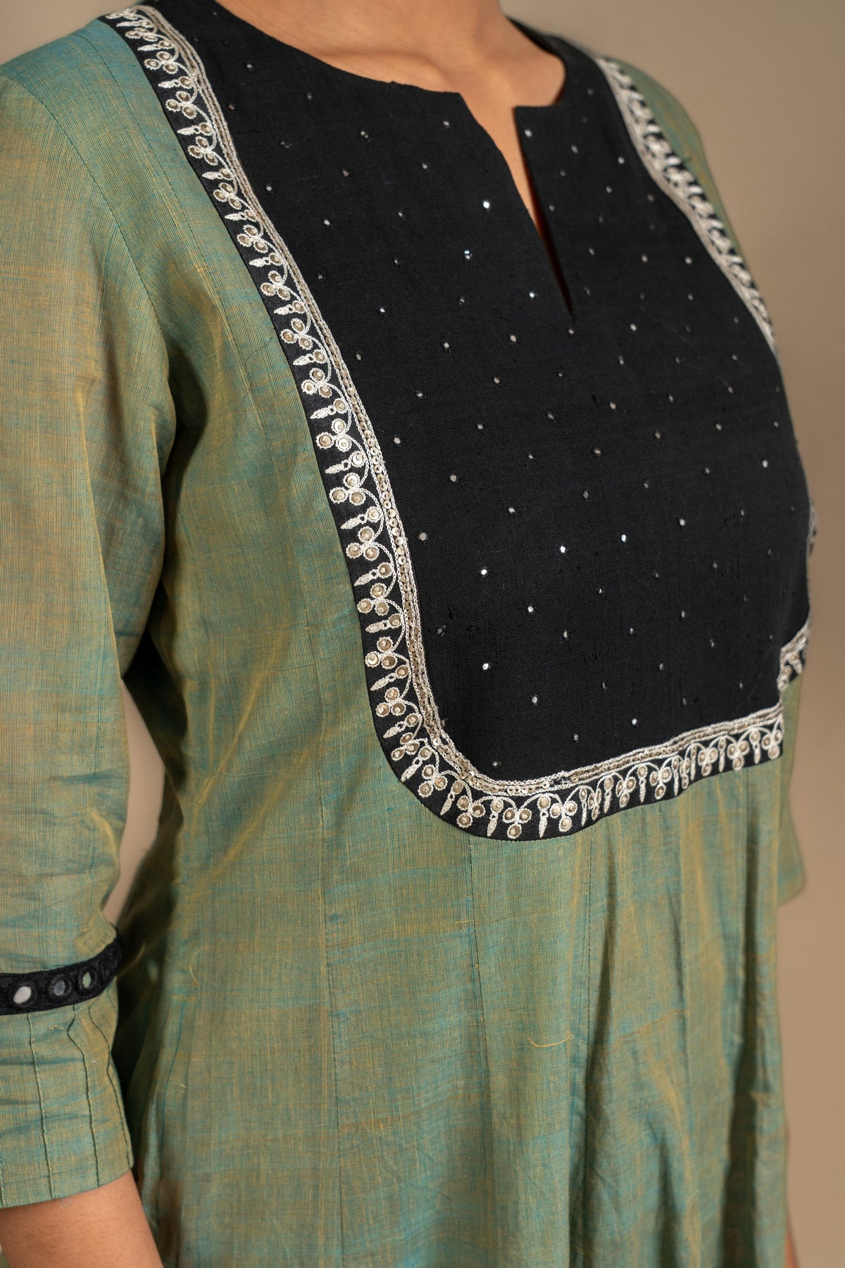 Green with black handloom Kali top mirror and sequin work on yoke with black Kota dupatta with thread work, cotton pant