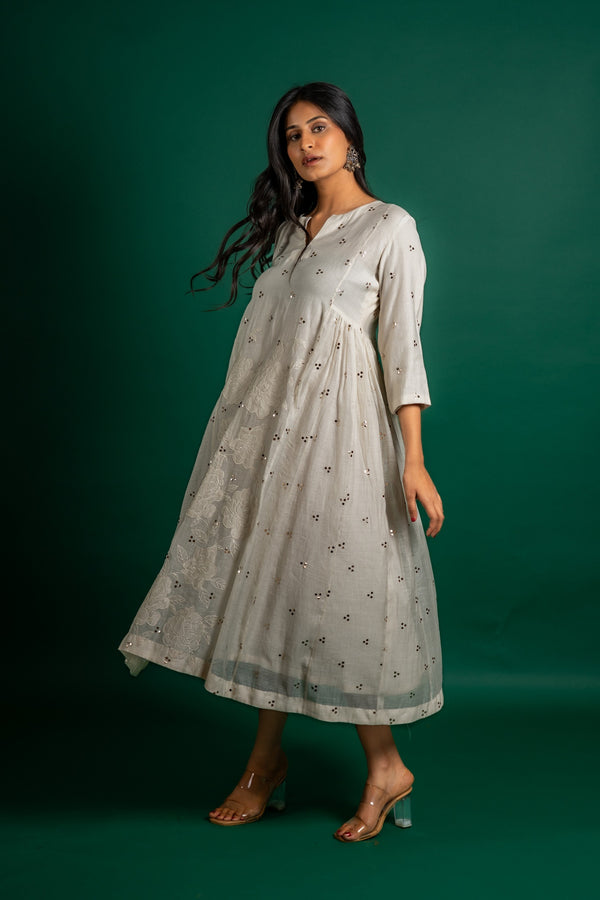 Off white Chanderi cotton panel frock with Mukesh work and centre panel patch work