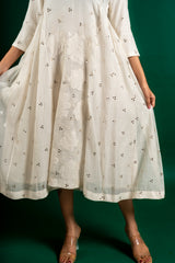 Off white Chanderi cotton panel frock with Mukesh work and centre panel patch work