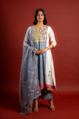 Grey and off white panel handloom top with Gota lace work on yoke in Daman zari pita work and grey Kota dupatta with work and cotton pant