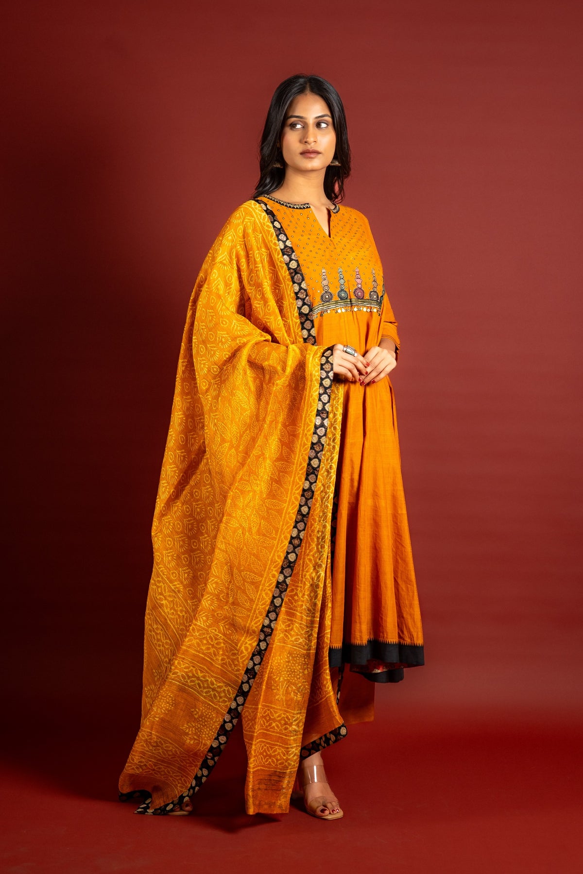 Saffron shade handloom Kali top with kalamkari with tiny mirror work, delicate zari work on neck with Maheshwari dupatta and pant