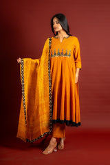 Saffron shade handloom Kali top with kalamkari with tiny mirror work, delicate zari work on neck with Maheshwari dupatta and pant