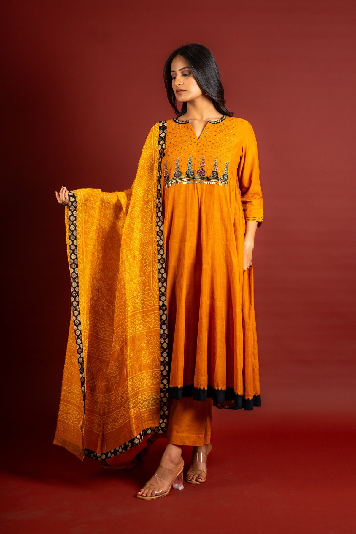 Saffron shade handloom Kali top with kalamkari with tiny mirror work, delicate zari work on neck with Maheshwari dupatta and pant