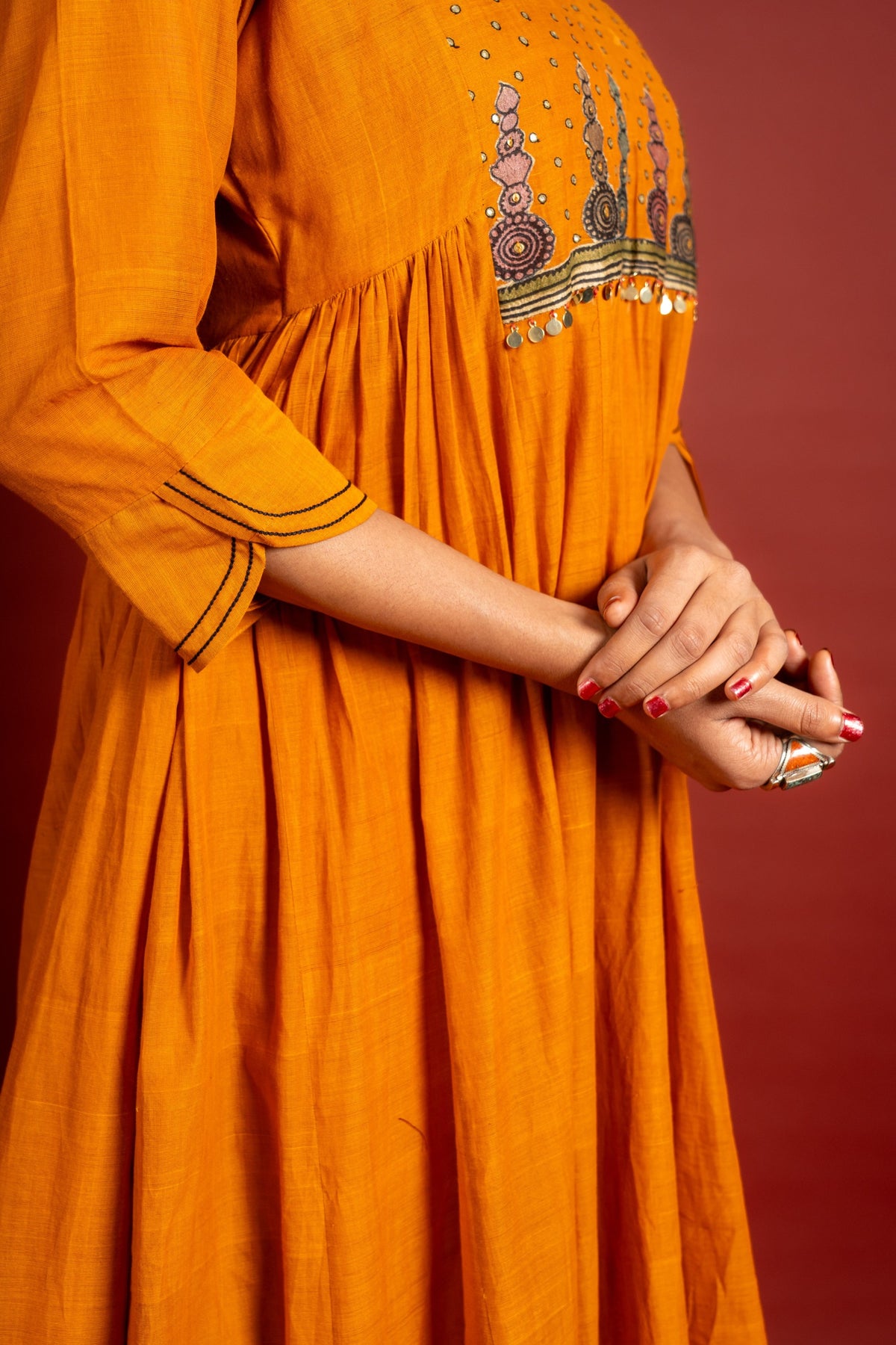 Saffron shade handloom Kali top with kalamkari with tiny mirror work, delicate zari work on neck with Maheshwari dupatta and pant