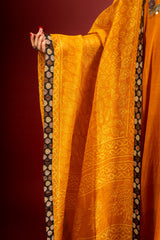 Saffron shade handloom Kali top with kalamkari with tiny mirror work, delicate zari work on neck with Maheshwari dupatta and pant