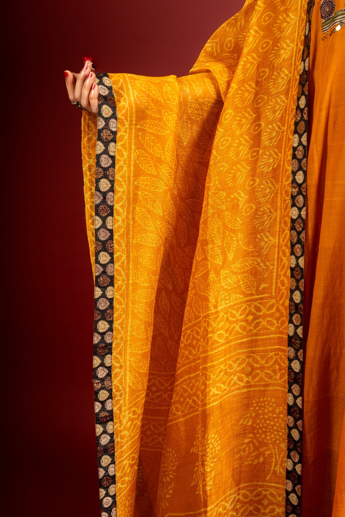 Saffron shade handloom Kali top with kalamkari with tiny mirror work, delicate zari work on neck with Maheshwari dupatta and pant