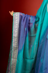 Vibrant turquoise blue kali handloom top, multicolour thread embroidery with mirror work on yoke and tie and dye shaded dupatta with work and self colour pant