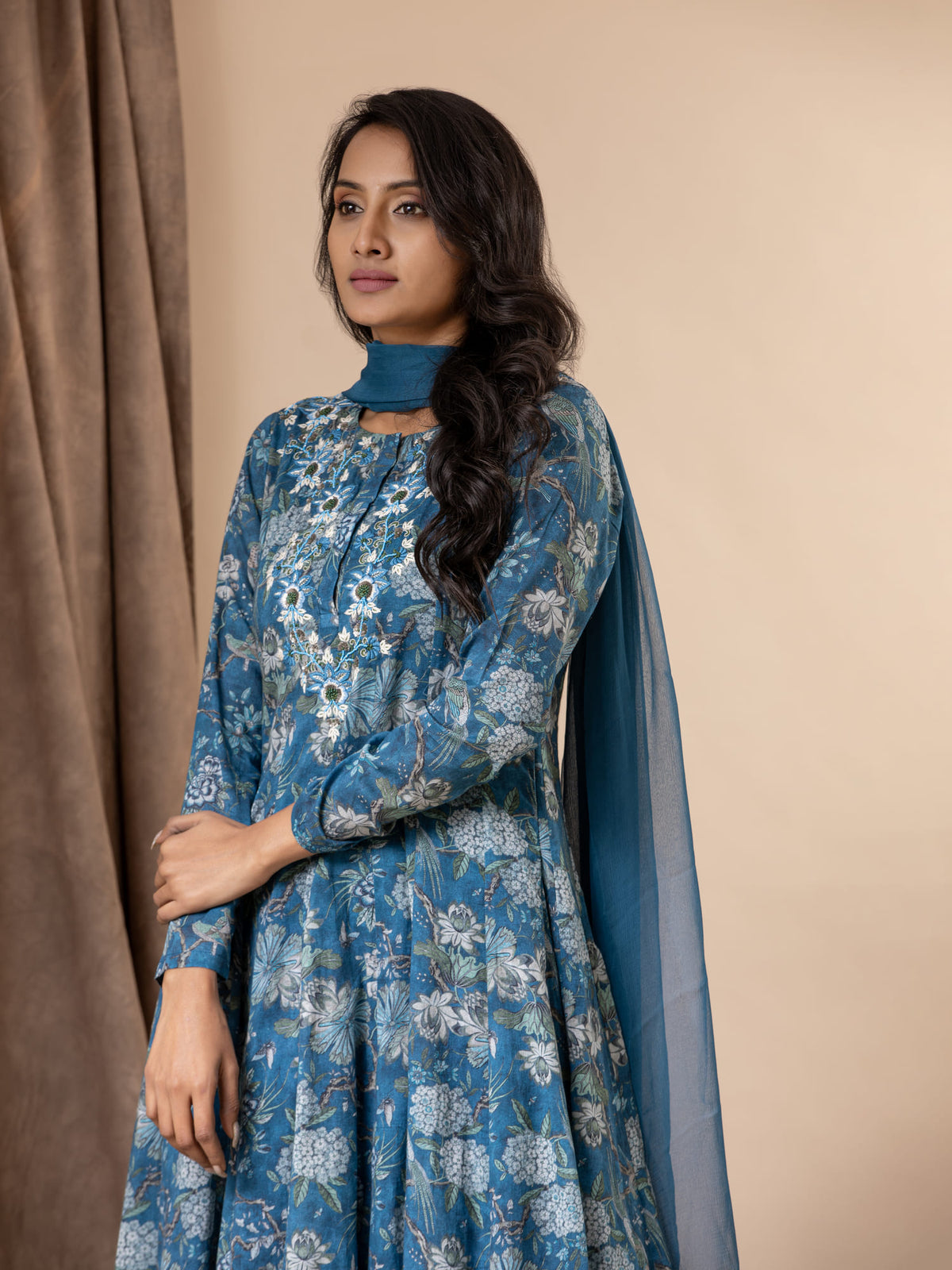 Blue floral printed kali top in muslin with intricate hand embroidery detailing, paired with a dupatta and pants
