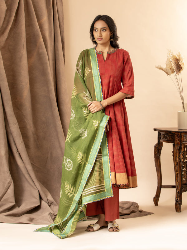 Burnt red handloom checkered kalidar with a green printed Kota dupatta highlighted with sequins, paired with loose pants
