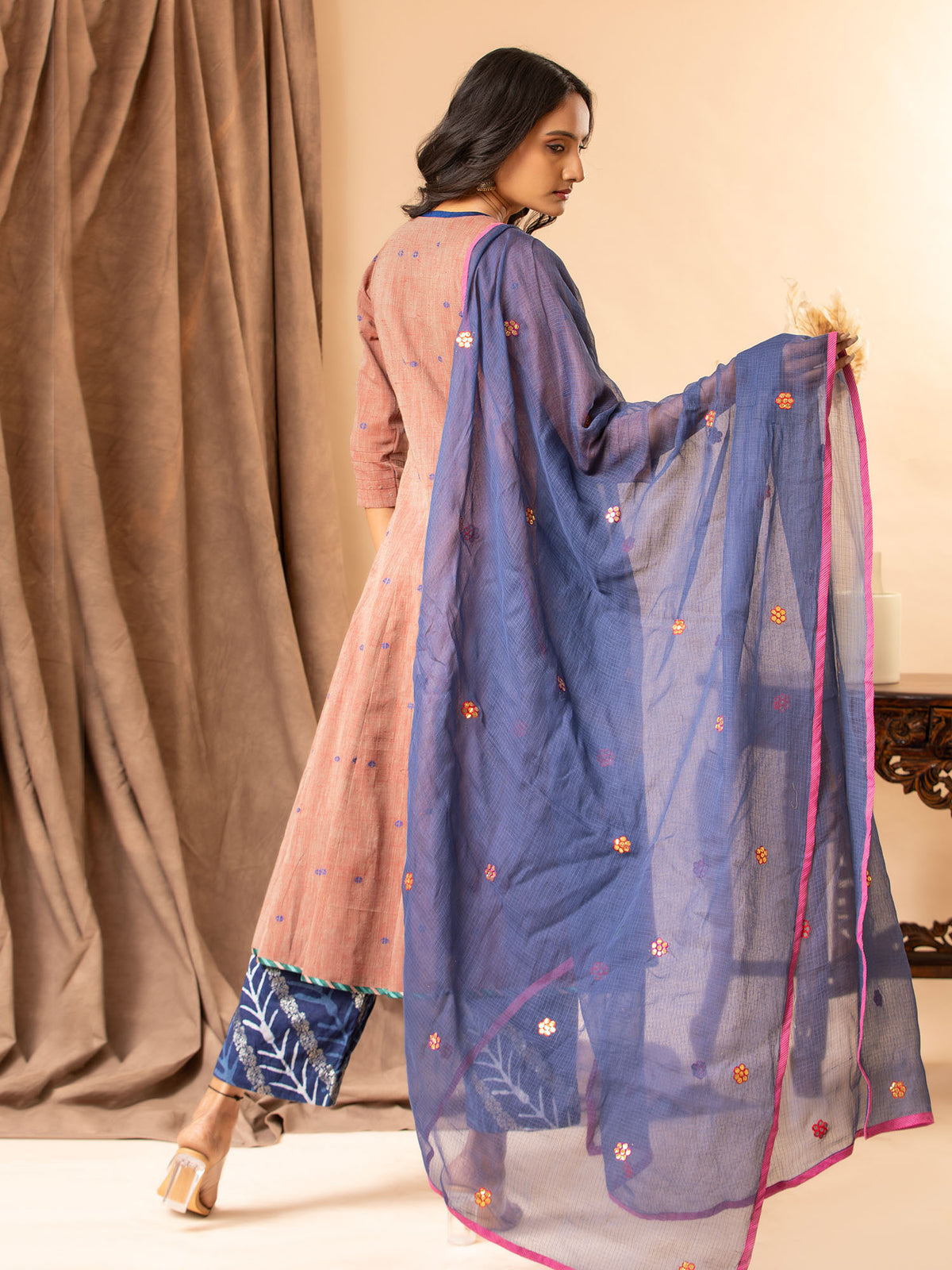 Dusky mauve handwoven kali top with Gota and thread work bhuttis on the kalis, paired with printed pants and a koti dupatta featuring Gota Patti work