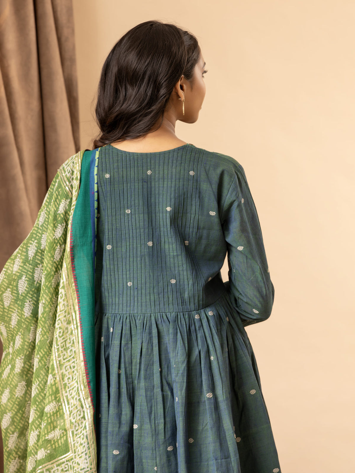 Dusky teal handwoven gathered top with thread and sequin work on the neckline, paired with a printed Kota dupatta and matching pants
