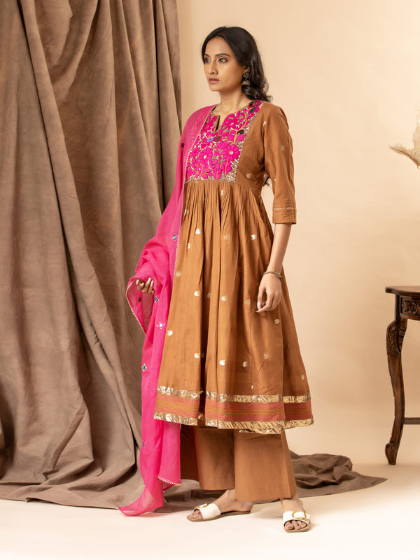 Handwoven brown top with silver zari buti, gathered kali design, and Gujari work with sequin detailing on the yoke