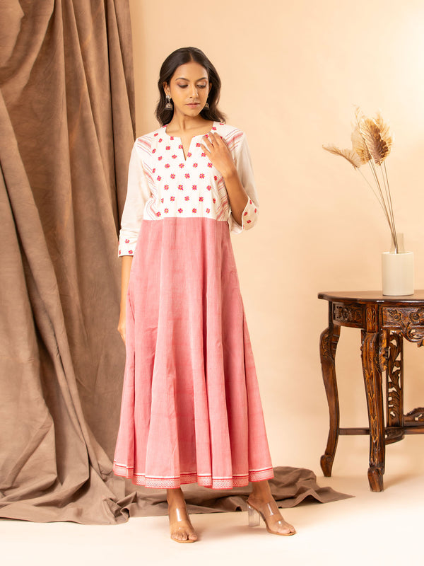 Handwoven white and red kali frock with thread work yoke and intricate thread work lines.
