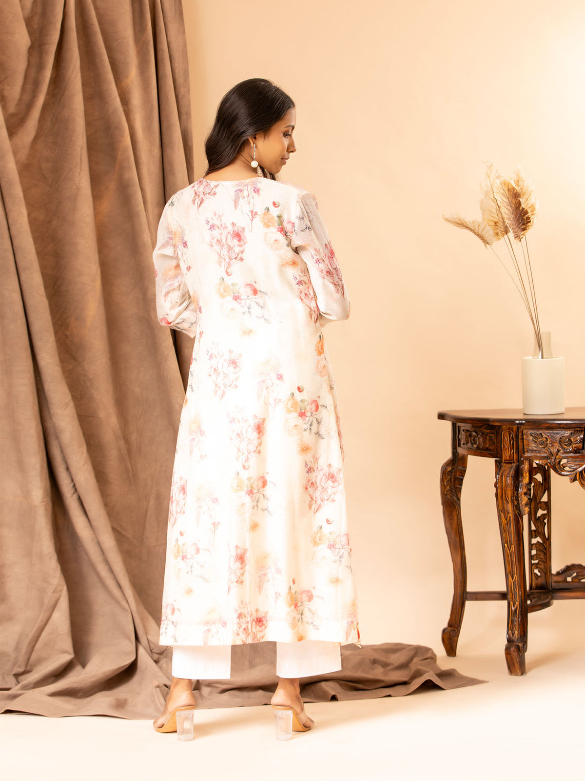 Ivory floral printed Chanderi straight cut top with embroidery on the yoke, paired with stretchable Lycra pants