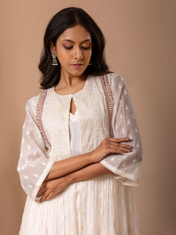 Ivory self-thread bhuti coatstyle top with a hand embroidery detailing, paired with a slip and pants