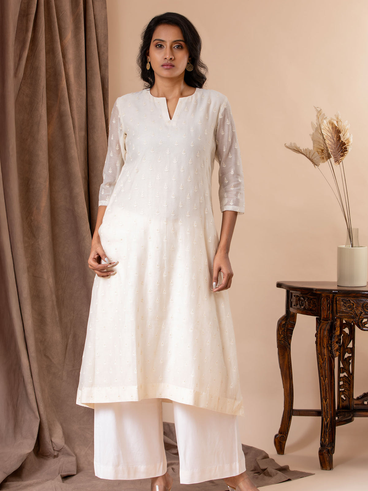 Ivory thread work Chanderi top with a Chanderi dupatta featuring all-over embroidery, paired with pants