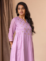 Lavender mul fabric panel top with side gathers, Gota and mirror detailing on the yoke, paired with printed colorful pants.