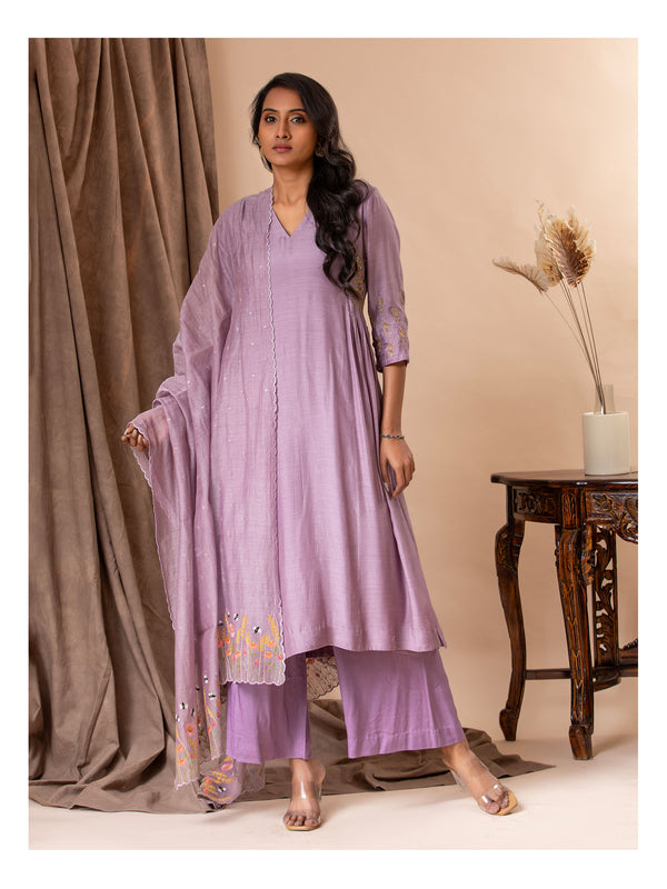 Light purple muslin top with gathered details on the sides and hand embroidery work, paired with a Chanderi embroidered dupatta along with pants.