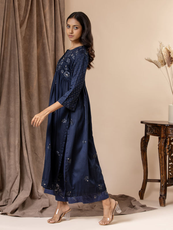 Midnight blue Chanderi gathered top with a floral thread embroidered yoke and all-over embroidery, paired with pants featuring thread embroidery