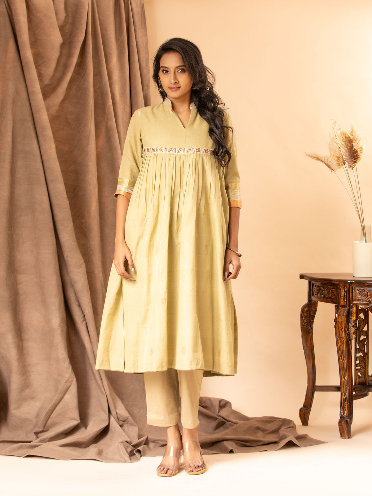 Muted sage handwoven gathered top with zari and silver bhuti, mirror and zari work detailing, paired with self-coloured pants