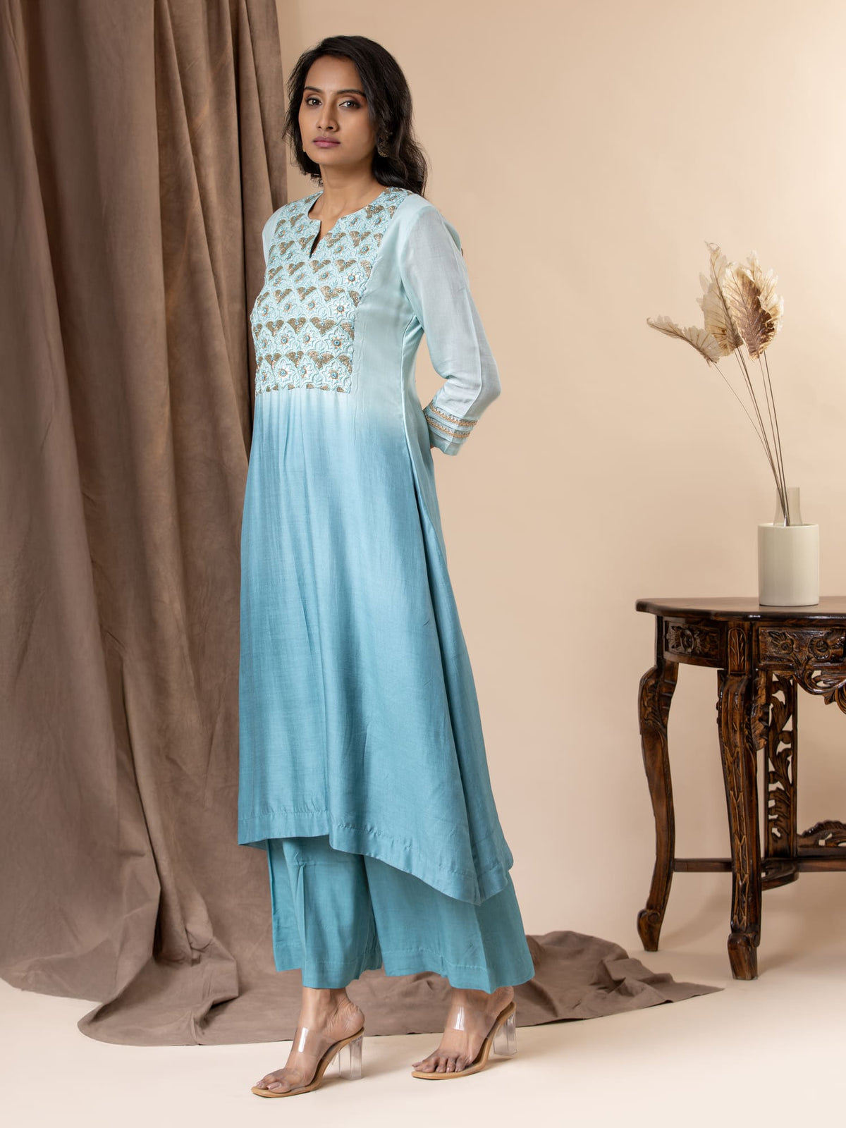 Shaded sky to light blue muslin top with Gota Patti work, cutdana detailing, and thread work hand embroidery, paired with pants