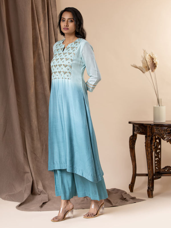 Shaded sky to light blue muslin top with Gota Patti work, cutdana detailing, and thread work hand embroidery, paired with pants