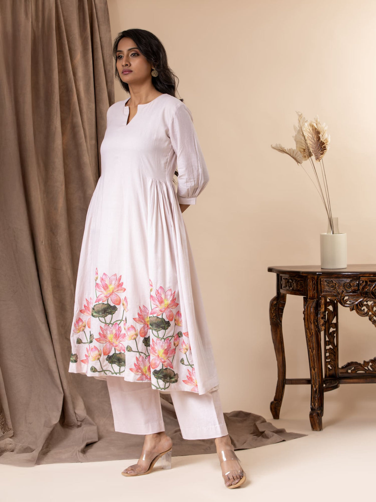 Soft blush pink mul gathered top with lotus applique work, highlighted with sequins, paired with pants
