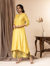 Yellow muslin top with thread and mirror work detailing, paired with Shibori tie-and-dye pants