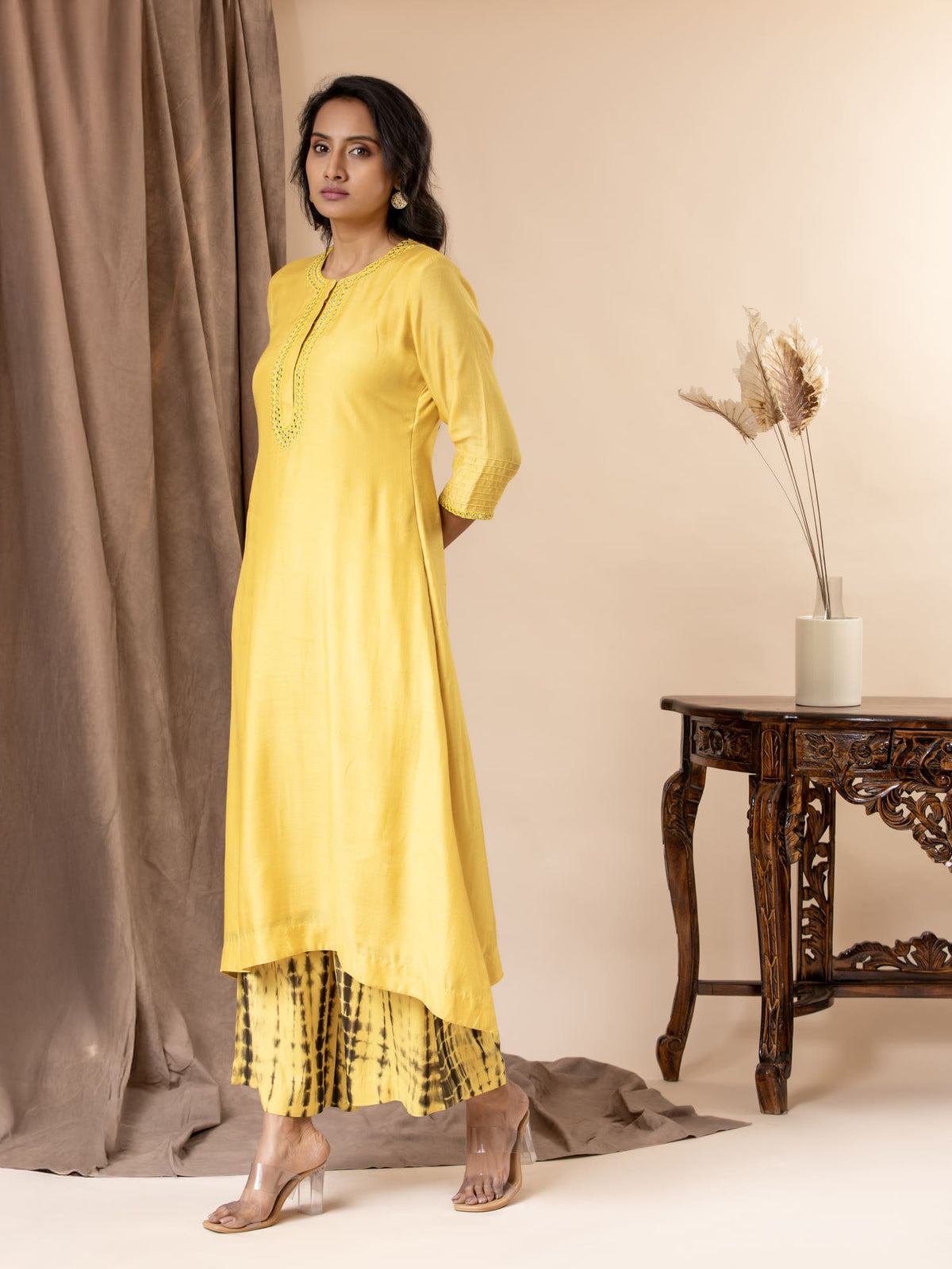 Yellow muslin top with thread and mirror work detailing, paired with Shibori tie-and-dye pants