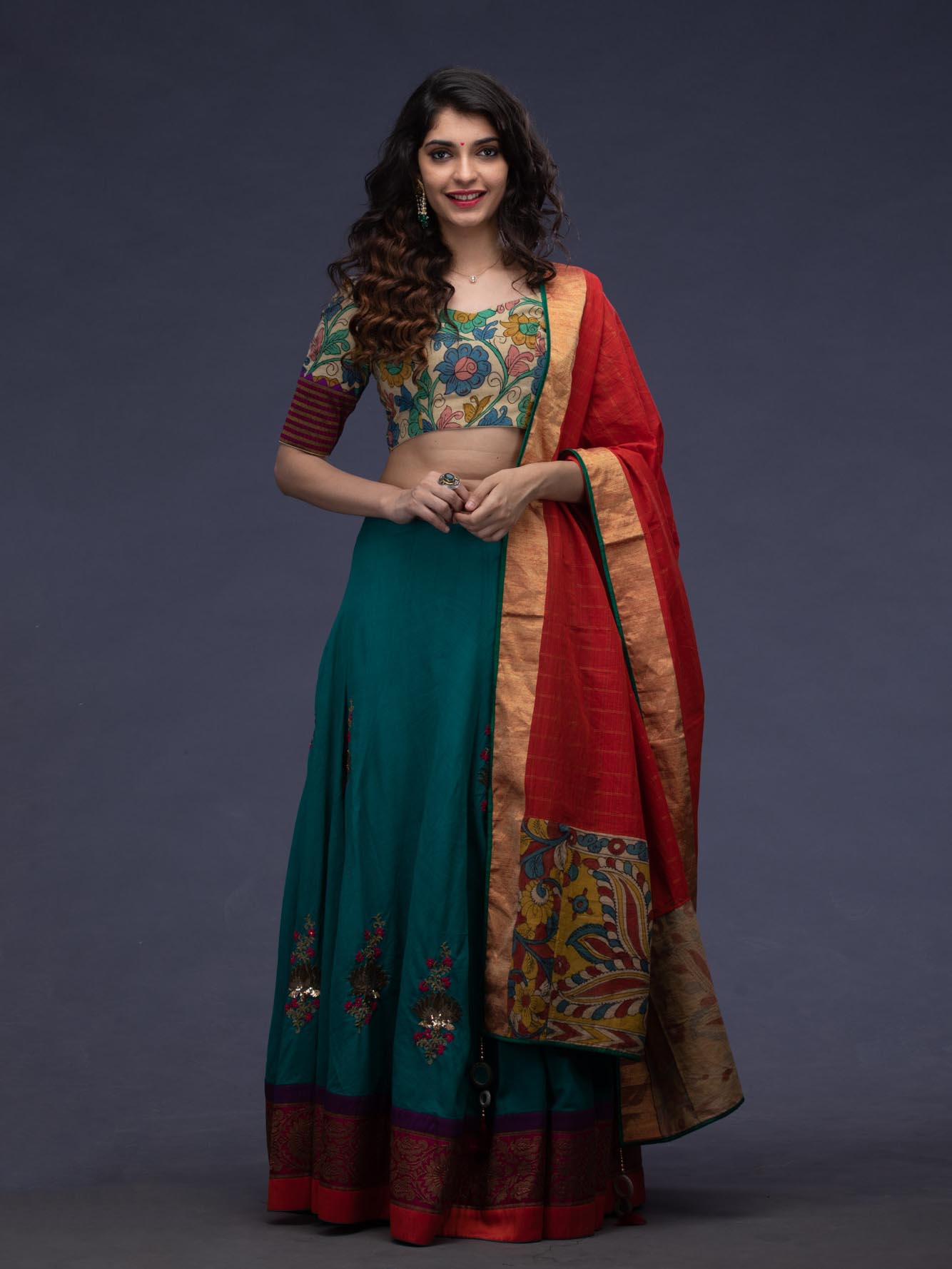 bottle green lehenga with red dupatta