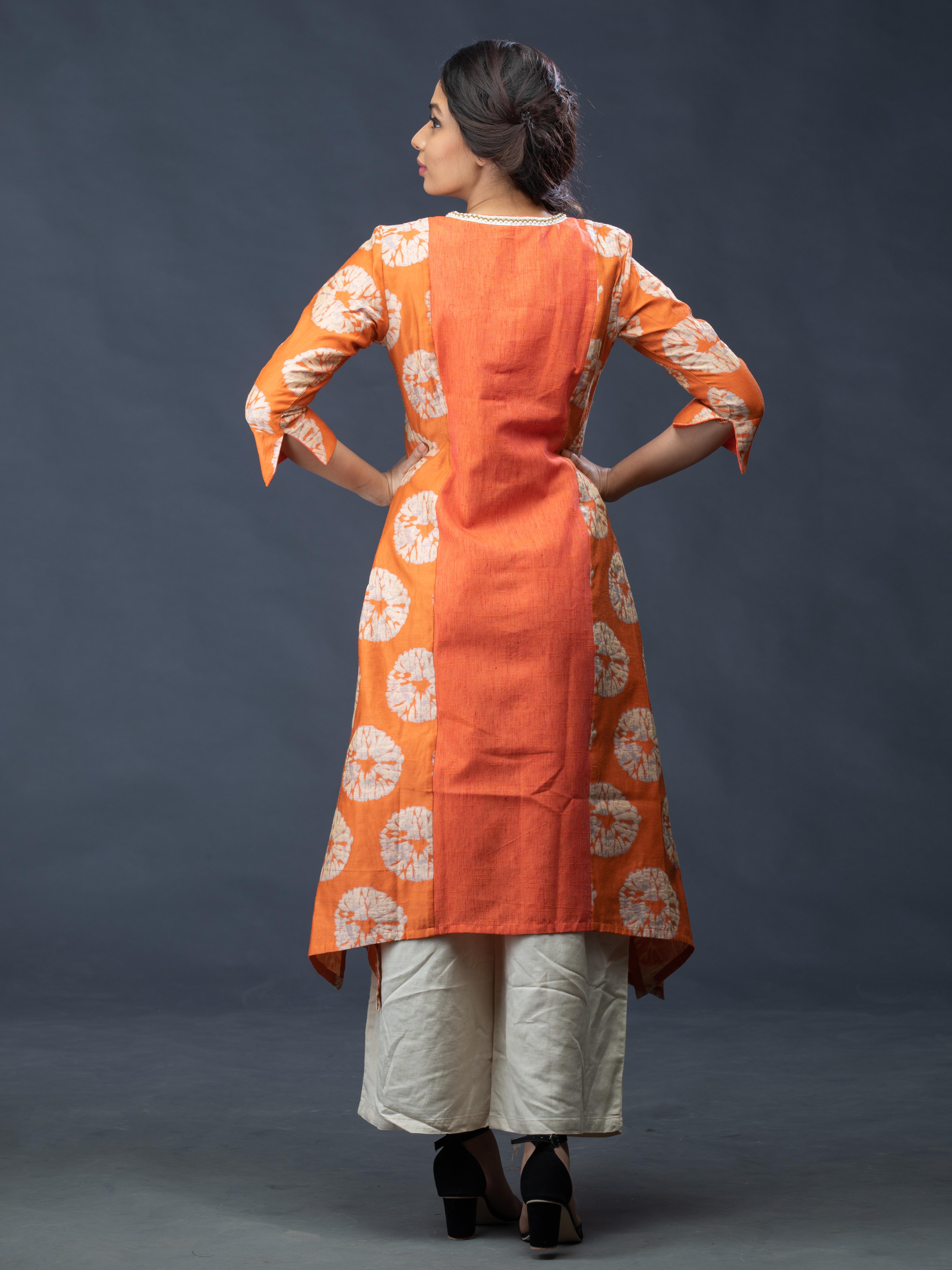 Orange Printed A Line Kurti with Beige Pants Mamatha Tulluri