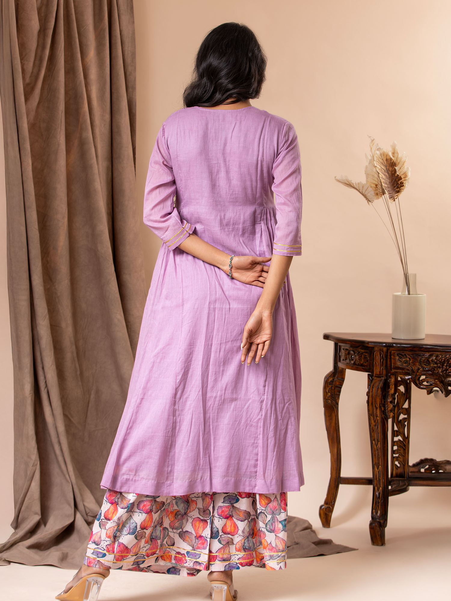 Lavender mul fabric panel top with side gathers, Gota and mirror detailing on the yoke, paired with printed colorful pants.
