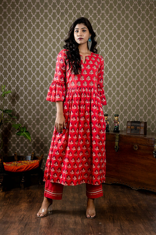 Red floral printed mull cotton dress with beads and sequin highlight work paired up with st pants