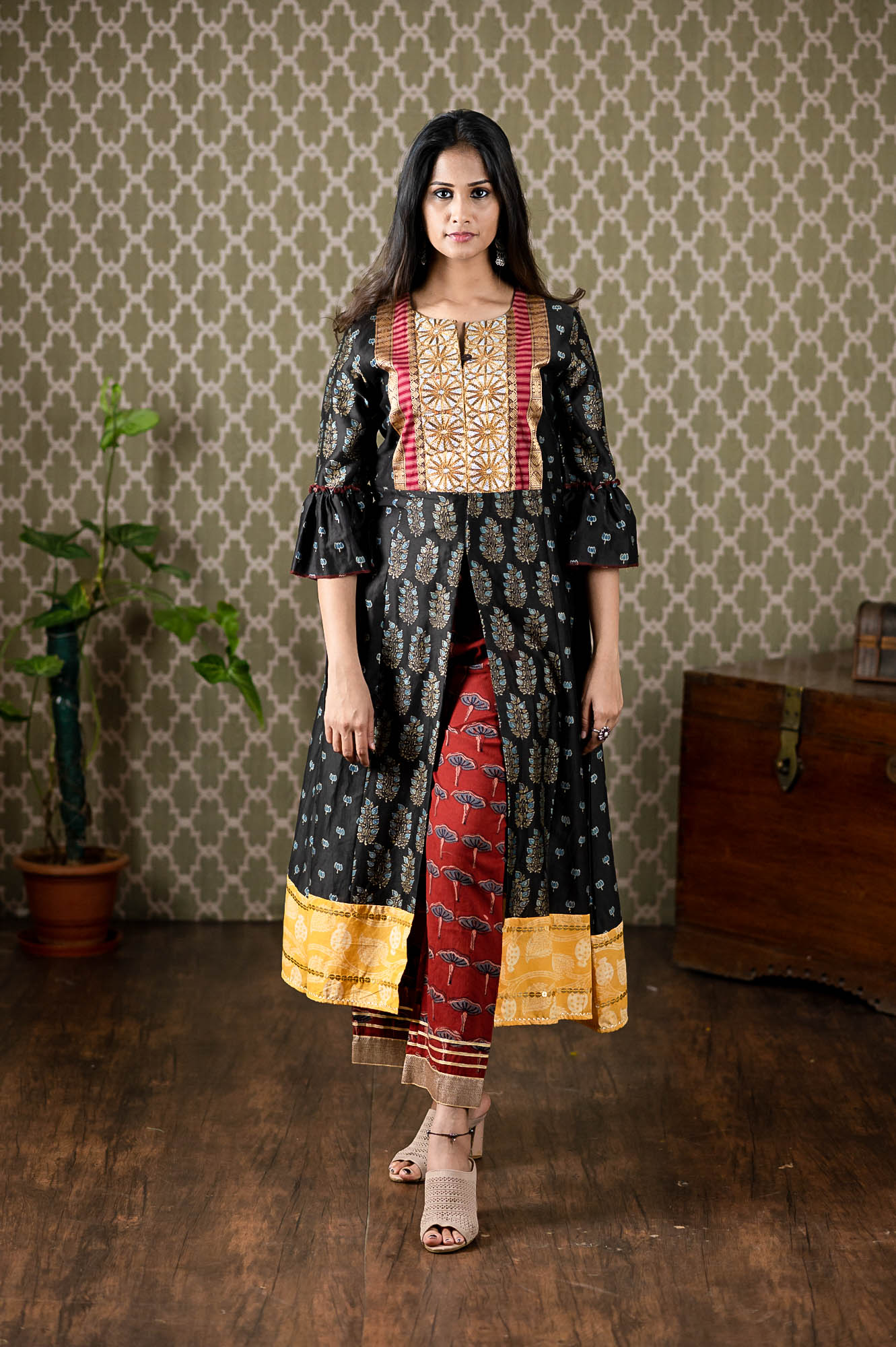 Handwoven Chanderi ajrakh printed kurta with sequin embroidery paired up with ajrakh printed pants