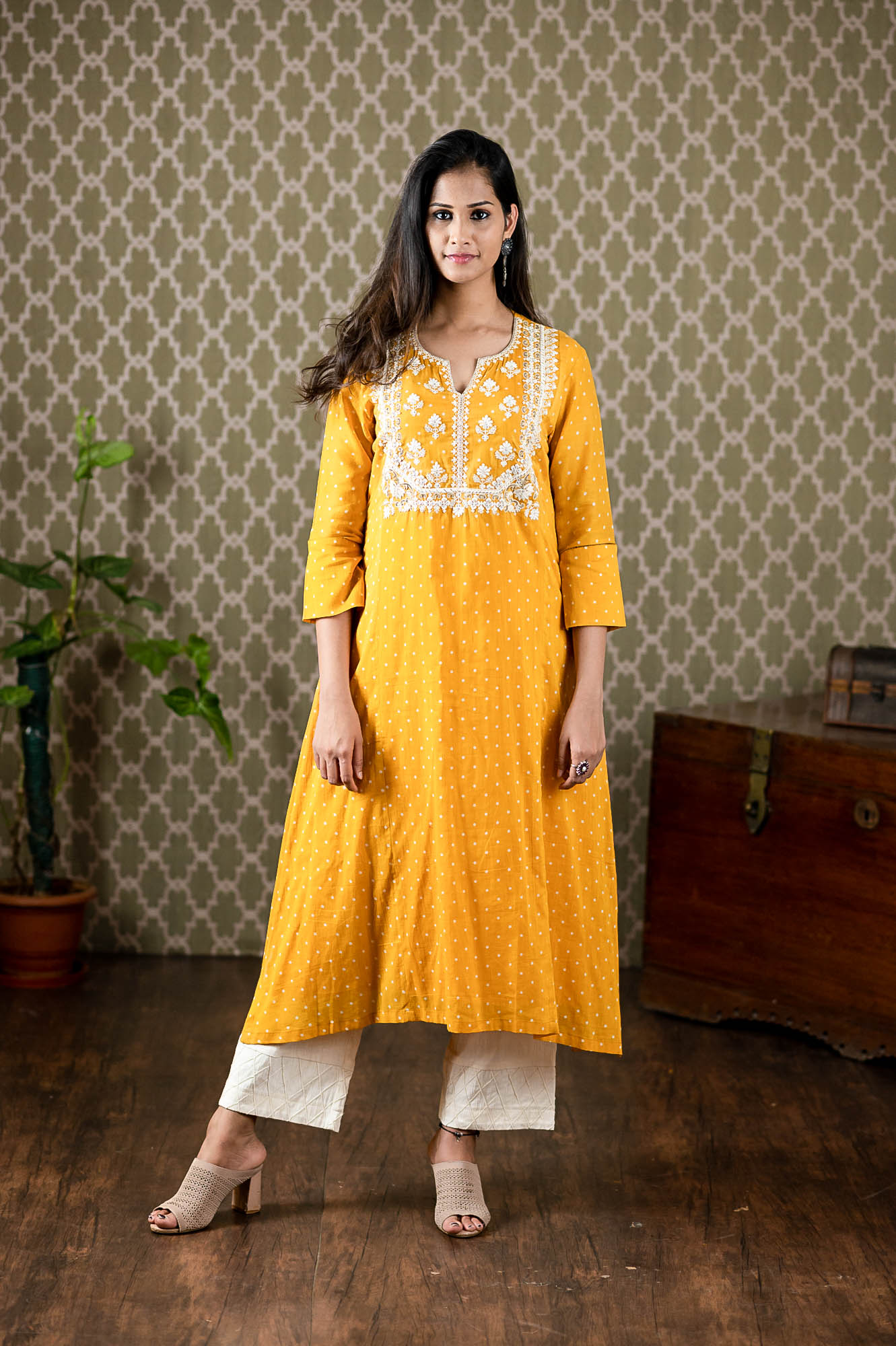 Yellow mull polka dots printed kurta with thread embroidery paired up with st cut pants