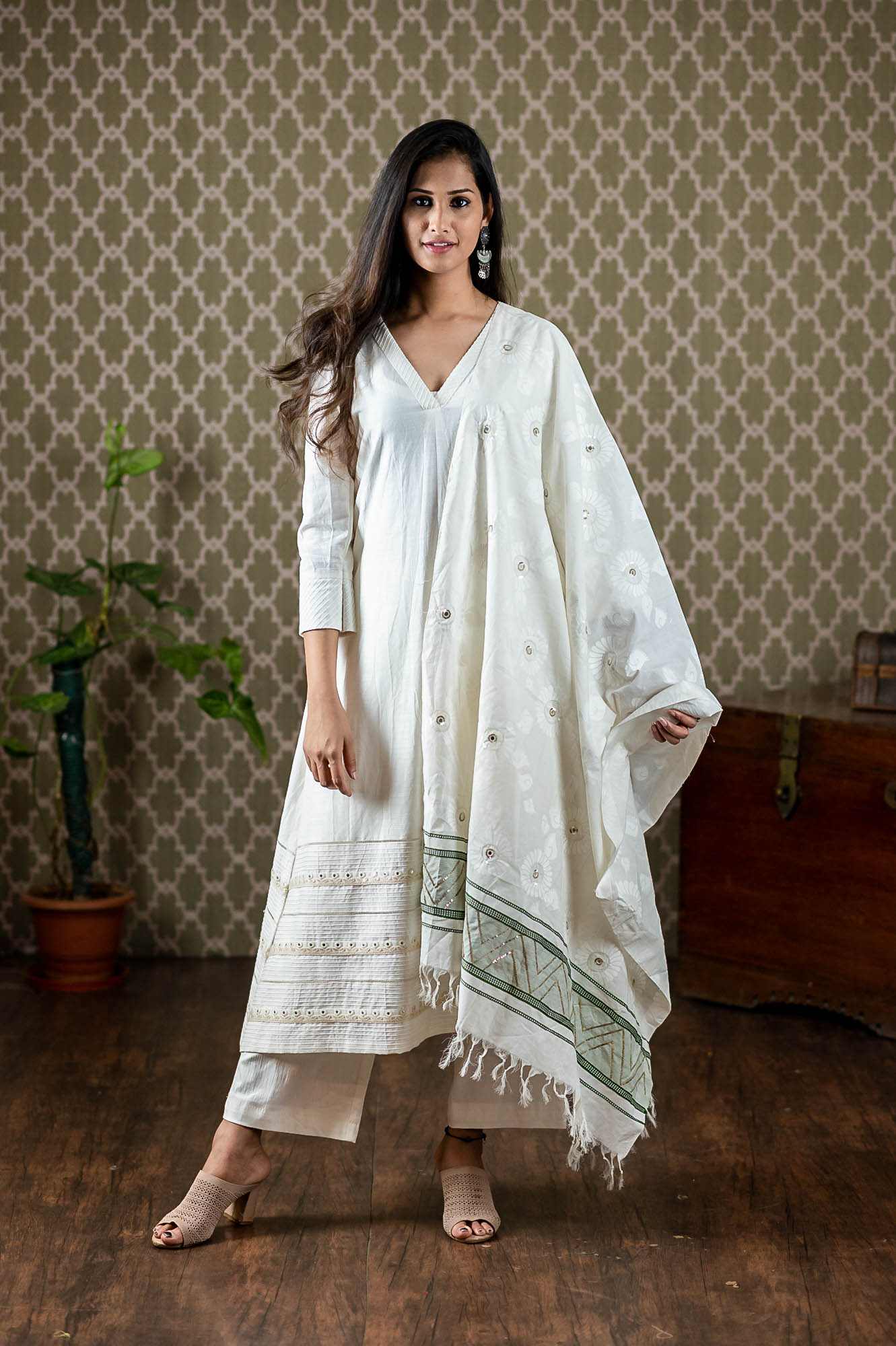 Handwoven cotton top with mirror and thread embroidery paired up with stretchable pants and handwoven cotton dupatta with self print and mirror sequin high light work